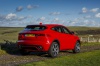 2019 Jaguar E-Pace P300 R-Dynamic AWD in Firenze Red Metallic from a rear right three-quarter view